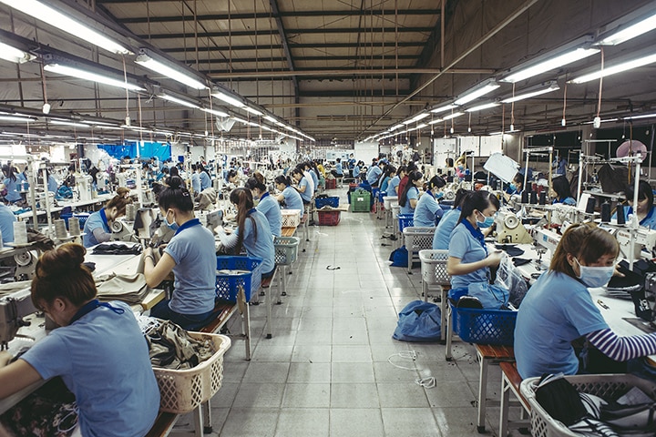 workers in a textil factory with sewing machine